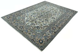 Corner detail of 2000s Kashan rug showing border pattern and Wool pile