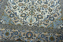 Close-up detail of 2000s Kashan rug from Iran / Persia showing Wool weave