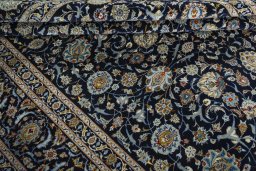 Close-up detail of 2000s Kashan rug from Iran / Persia showing Wool weave