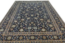 Surface texture of 2000s Kashan rug with natural Wool and intricate pattern
