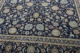 Close-up detail of 2000s Kashan rug from Iran / Persia showing Wool weave