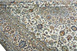 Close-up detail of 2000s Kashan rug from Iran / Persia showing Wool weave
