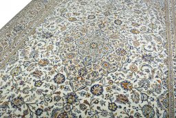 Backside of handmade 2000s Kashan rug showing knot structure and weave density
