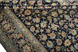 Close-up detail of 2000s Kashan rug from Iran / Persia showing Wool weave