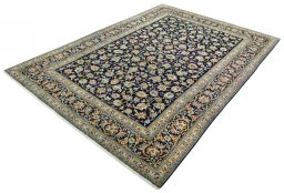 Corner detail of 2000s Kashan rug showing border pattern and Wool pile