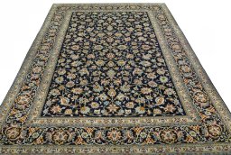 Surface texture of 2000s Kashan rug with natural Wool and intricate pattern