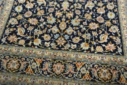 Close-up detail of 2000s Kashan rug from Iran / Persia showing Wool weave