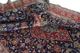 Surface texture of 2000s Kashan rug with natural Cork and intricate pattern