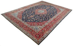 Corner detail of 2000s Kashan rug showing border pattern and Cork pile