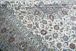 Close-up detail of 2000s Kashan rug from Iran / Persia showing Wool weave
