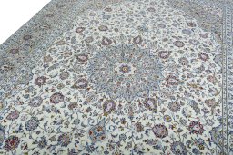Backside of handmade 2000s Kashan rug showing knot structure and weave density