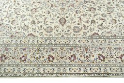 Corner detail of 2000s Kashan rug showing border pattern and Wool pile