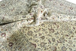 Surface texture of 2000s Kashan rug with natural Wool and intricate pattern