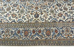 Corner detail of 2000s Kashan rug showing border pattern and Wool pile
