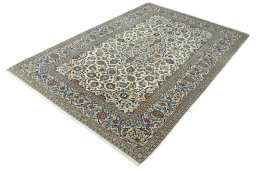 Corner detail of 2000s Kashan rug showing border pattern and Wool pile