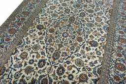 Backside of handmade 2000s Kashan rug showing knot structure and weave density