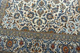 Close-up detail of 2000s Kashan rug from Iran / Persia showing Wool weave