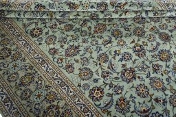 Close-up detail of 2000s Kashan rug from Iran / Persia showing Wool weave