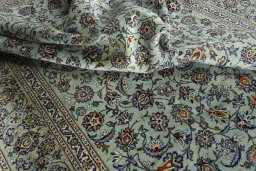 Surface texture of 2000s Kashan rug with natural Wool and intricate pattern