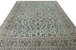 Surface texture of 2000s Kashan rug with natural Wool and intricate pattern
