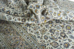Surface texture of 2000s Kashan rug with natural Wool and intricate pattern