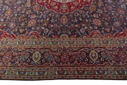 Corner detail of 2000s Kashan rug showing border pattern and Wool pile