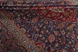Close-up detail of 2000s Kashan rug from Iran / Persia showing Wool weave