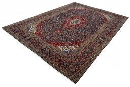 Corner detail of 2000s Kashan rug showing border pattern and Wool pile