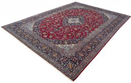 Corner detail of 2000s Kashan rug showing border pattern and Wool pile