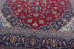Close-up detail of 2000s Kashan rug from Iran / Persia showing Wool weave