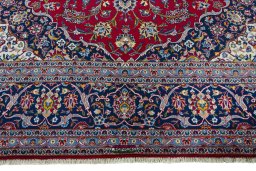 Full view of 2000s Kashan rug from Iran / Persia, 444 × 322 cm in Red tones