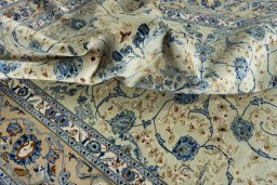 Surface texture of 2000s Kashan rug with natural Wool and intricate pattern