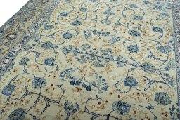 Backside of handmade 2000s Kashan rug showing knot structure and weave density