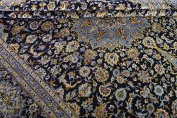 Close-up detail of 2000s Kashan rug from Iran / Persia showing Wool weave