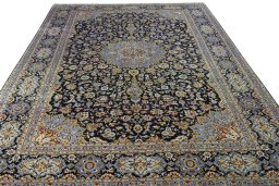 Surface texture of 2000s Kashan rug with natural Wool and intricate pattern