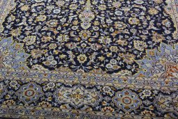 Close-up detail of 2000s Kashan rug from Iran / Persia showing Wool weave