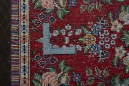 Backside of handmade New Kashan rug showing knot structure and weave density