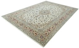 Corner detail of 2000s Kashan rug showing border pattern and Wool pile