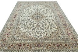 Surface texture of 2000s Kashan rug with natural Wool and intricate pattern