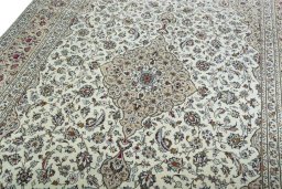 Backside of handmade 2000s Kashan rug showing knot structure and weave density