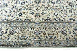 Surface texture of 2000s Kashan rug with natural Wool and intricate pattern