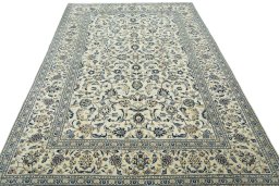 Surface texture of 2000s Kashan rug with natural Wool and intricate pattern