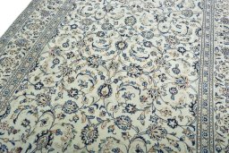 Backside of handmade 2000s Kashan rug showing knot structure and weave density