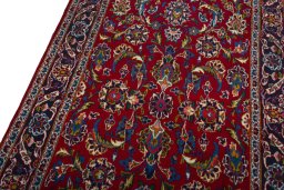 Backside of handmade 2000s Kashan rug showing knot structure and weave density