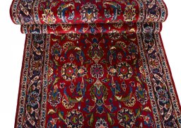 Full view of 2000s Kashan rug from Iran / Persia, 420 × 104 cm in Red tones