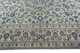 Corner detail of 2000s Kashan rug showing border pattern and Wool pile