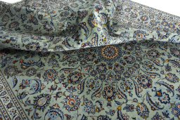 Surface texture of 2000s Kashan rug with natural Wool and intricate pattern