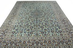 Surface texture of 2000s Kashan rug with natural Wool and intricate pattern