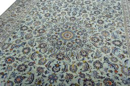 Backside of handmade 2000s Kashan rug showing knot structure and weave density