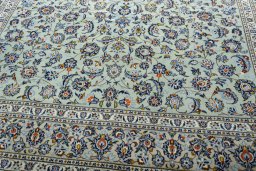 Close-up detail of 2000s Kashan rug from Iran / Persia showing Wool weave